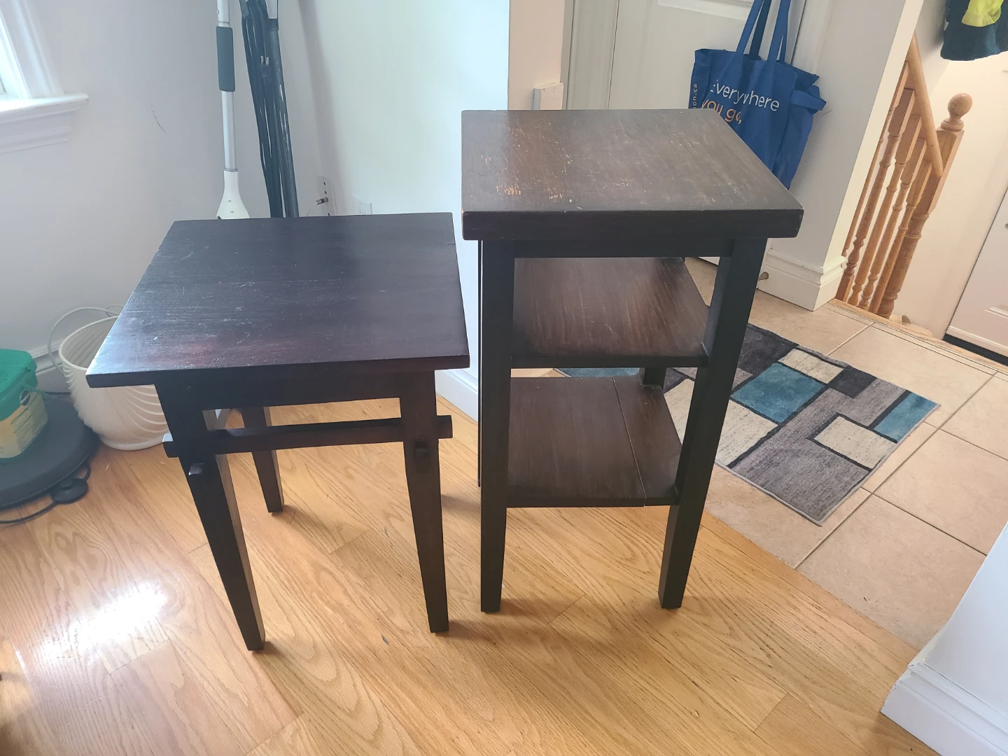 Two dark wood side tables