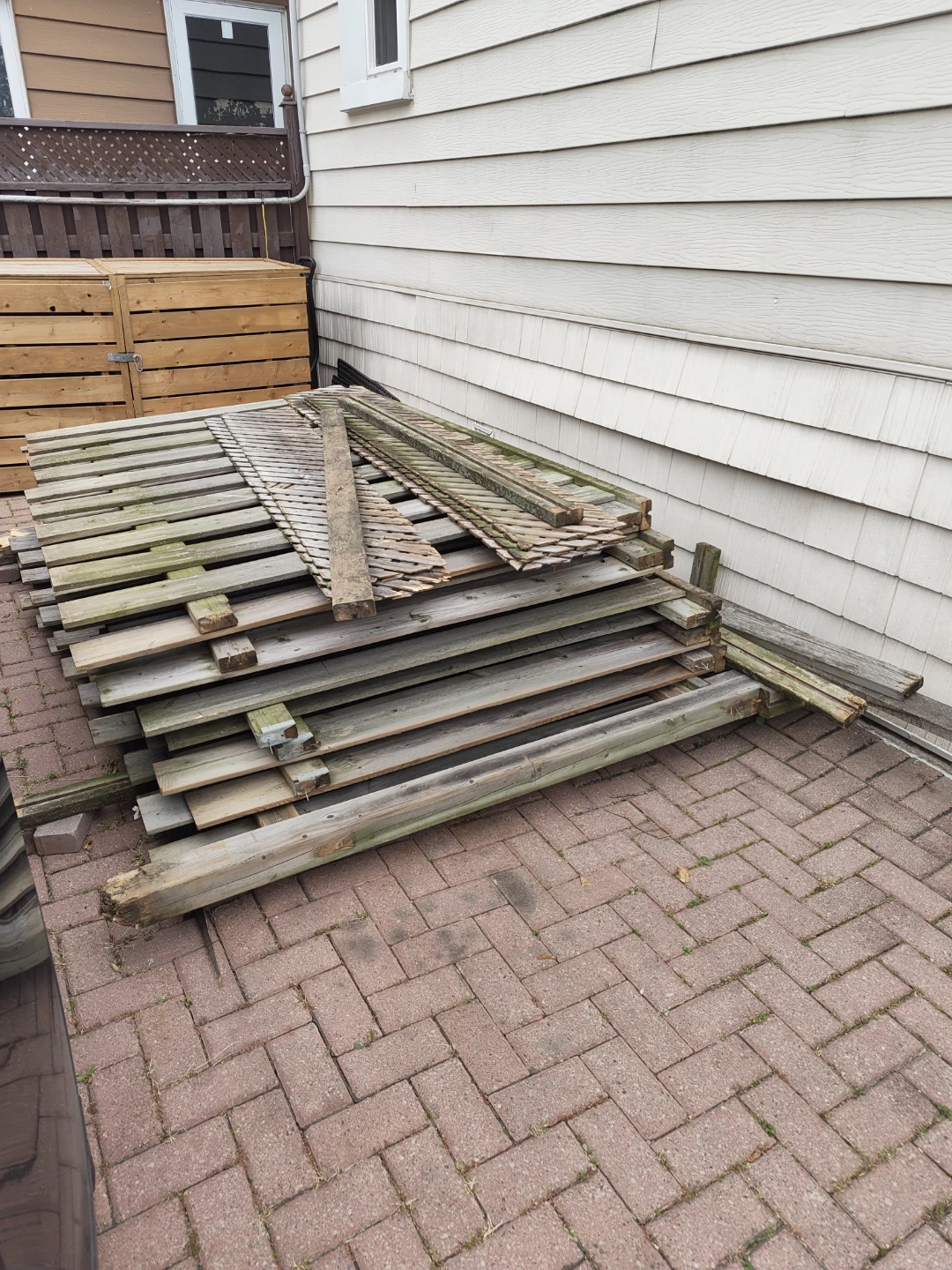 Assorted used wooden fence panels