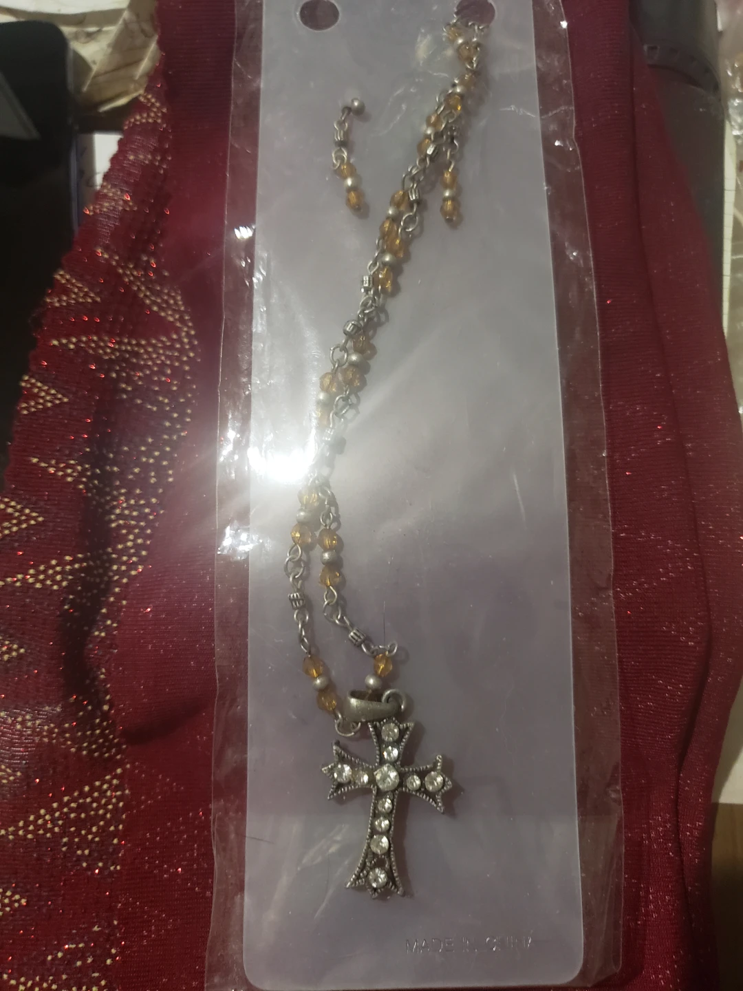 Cross Pendant Necklace with Amber-Colored Beads and earrings
