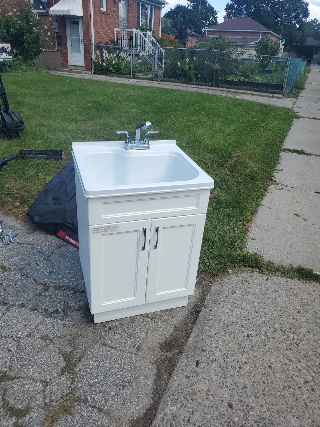 White laundry tub with cabinet