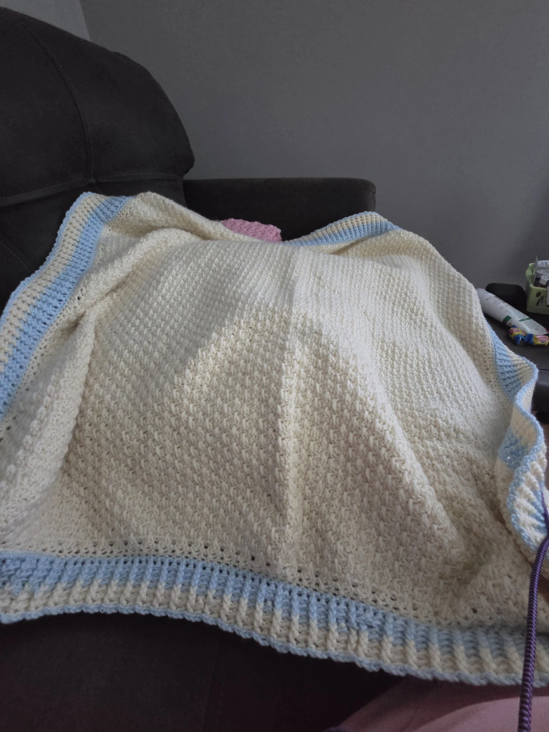Hand-crocheted cream baby blanket