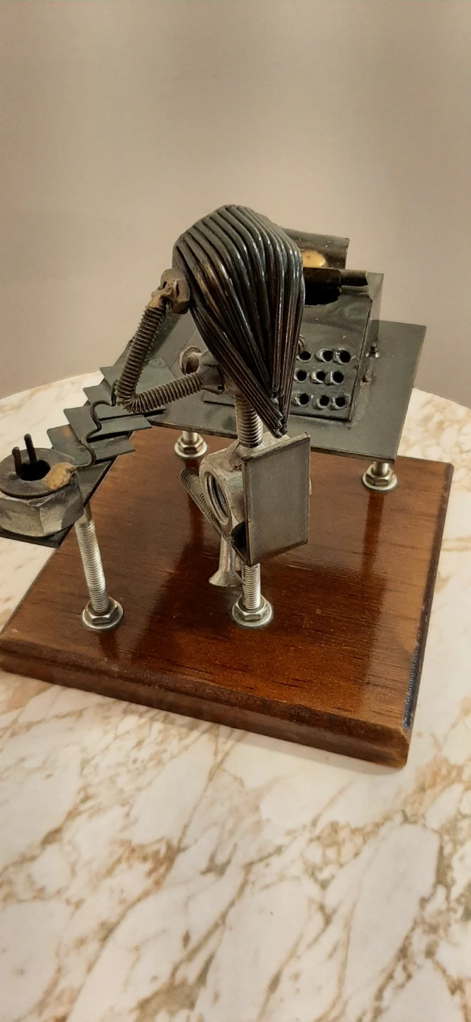 Metal art sculpture of an office worker at a desk - photo 3