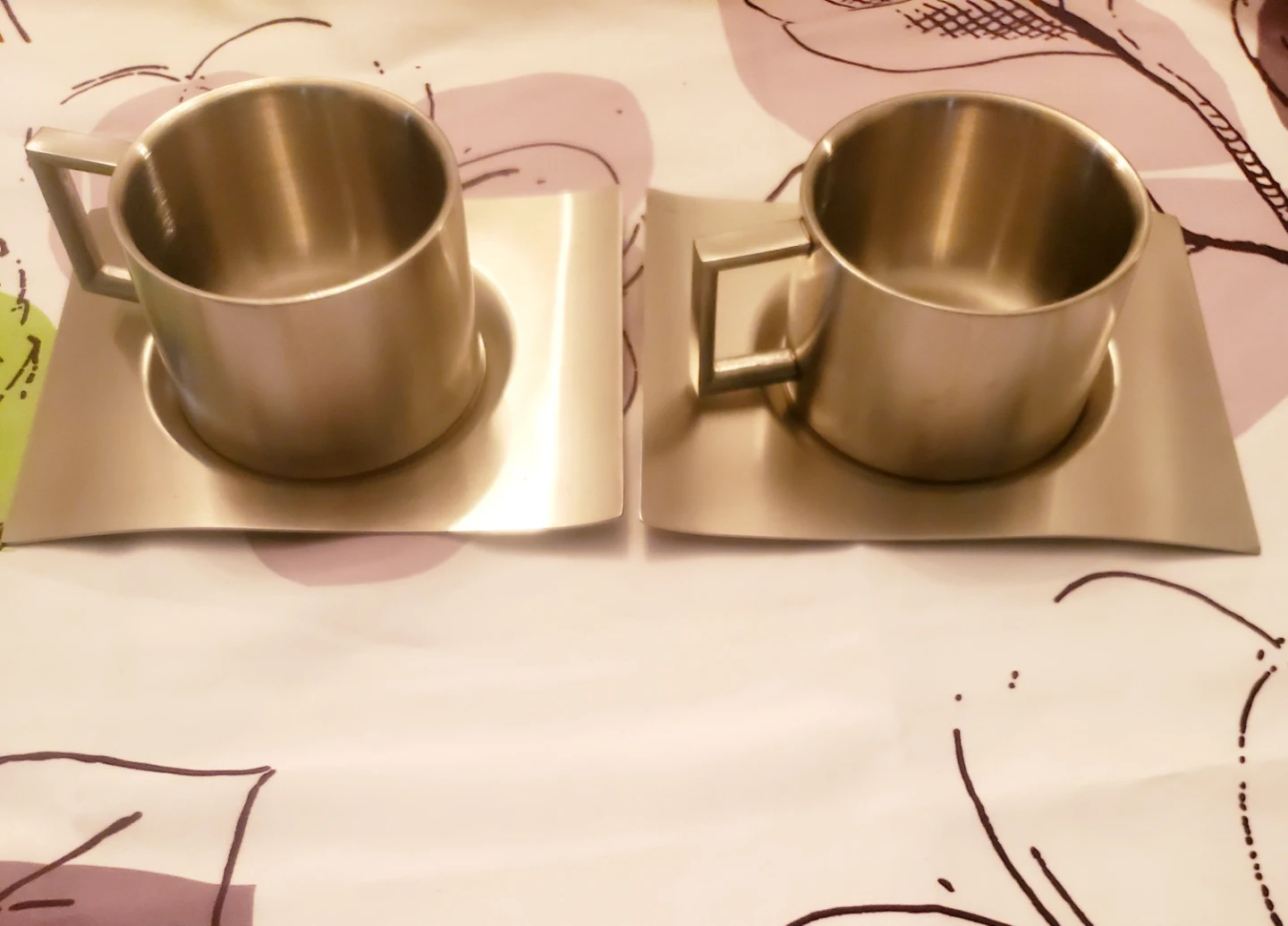 Set of Two Stainless Steel Mugs with Matching Saucers
