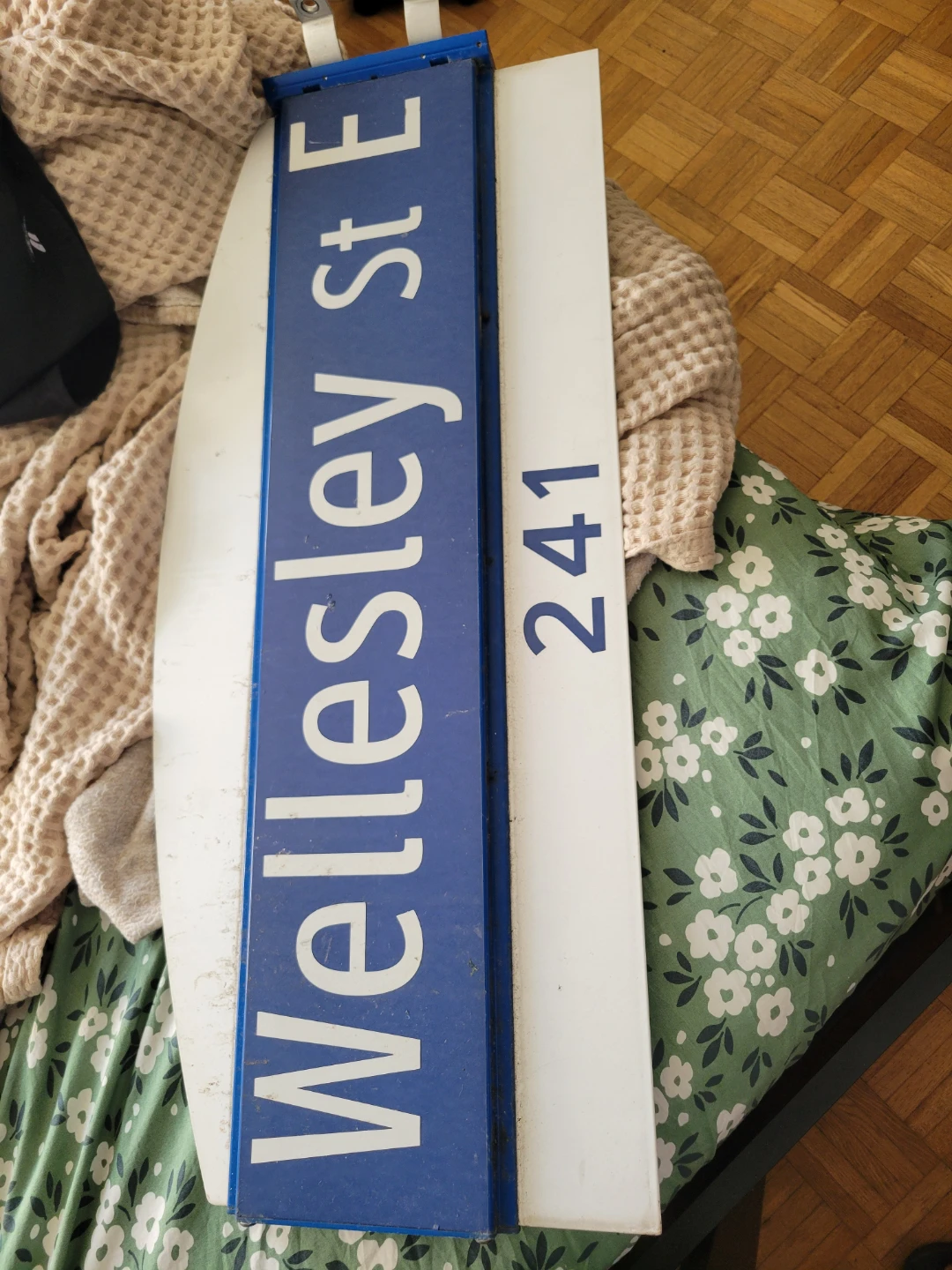 Wellesley St E 241 street sign