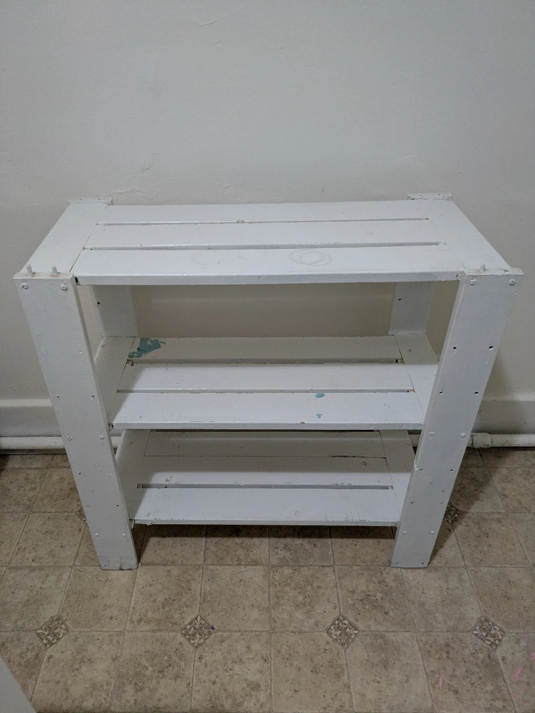 White painted wooden three-shelf unit