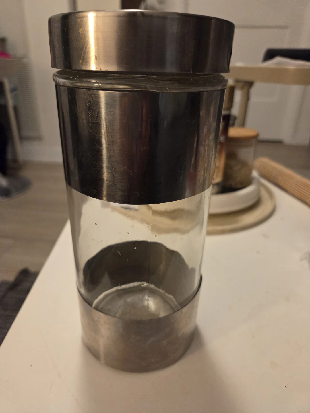 Glass storage canister with stainless steel accents