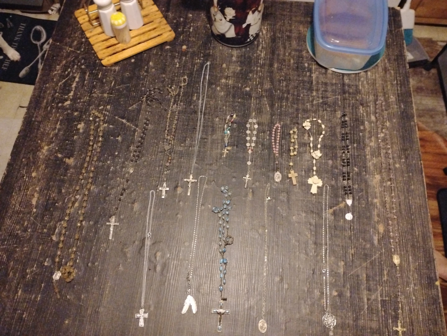 Collection of assorted religious rosaries and necklaces