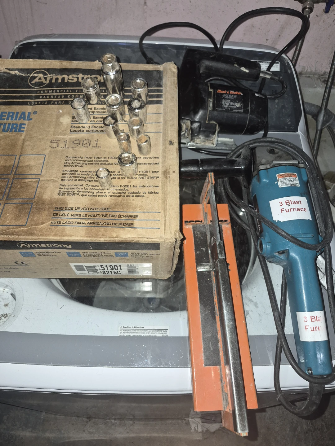 Assorted power tools and socket set