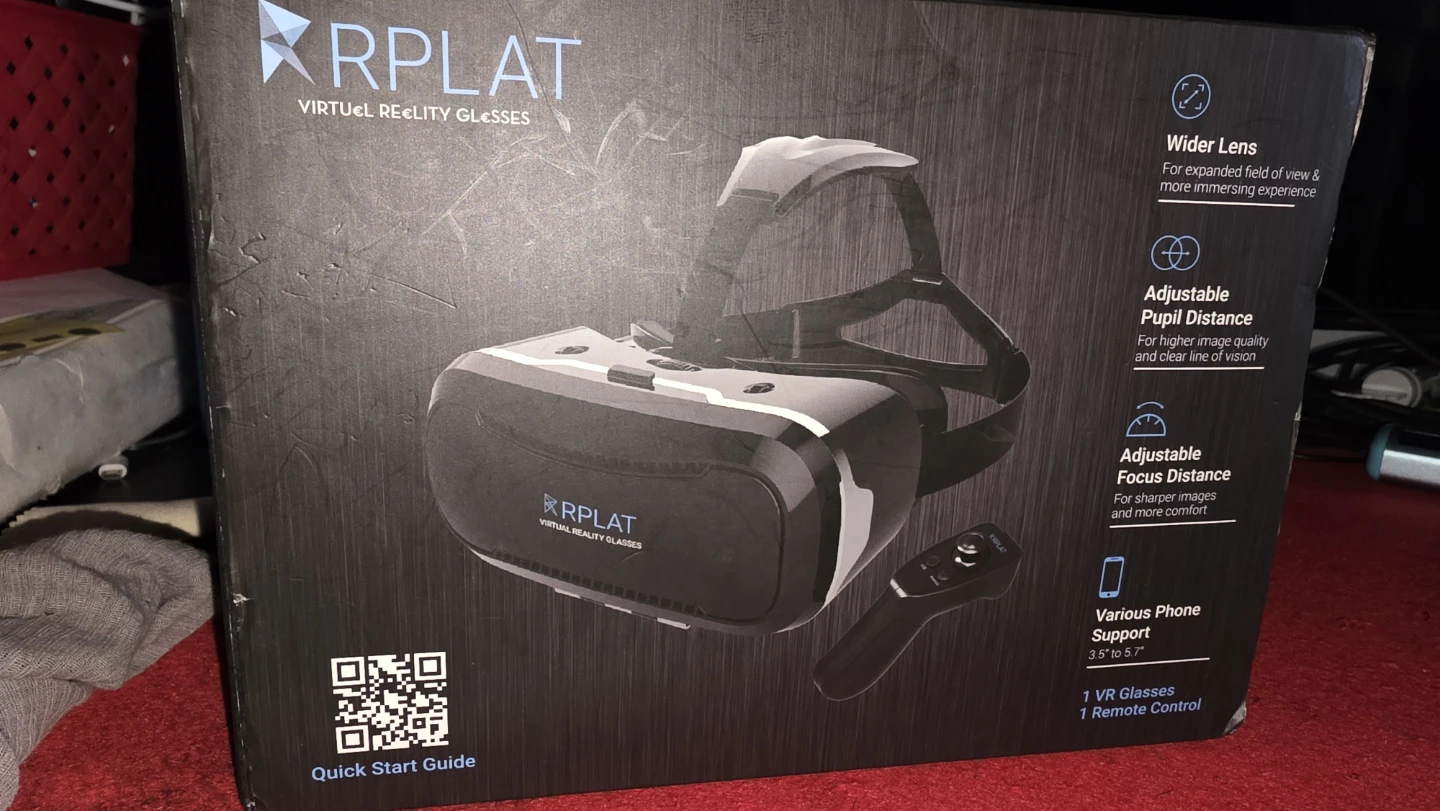 Brand new in box VR headset with a one-handed controller.
