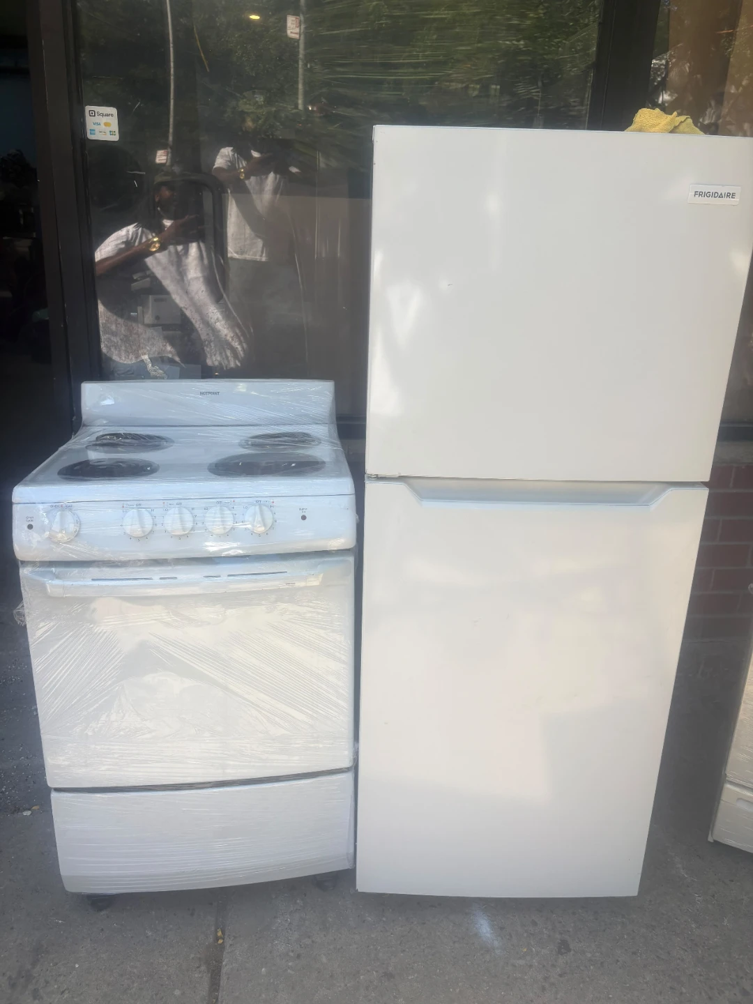 Frigidaire 24in Refrigerator and Hotpoint Electric Range