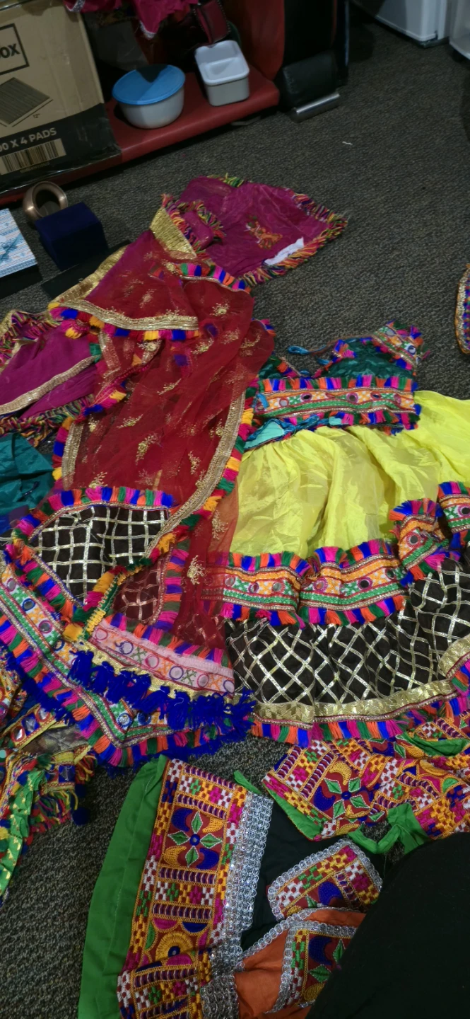 Set of traditional embroidered outfits for kids.