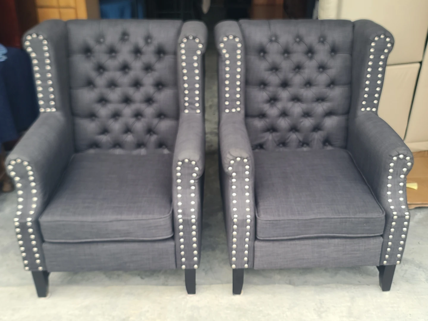 Pair of Tufted Wingback Chairs with Nailhead Trim
