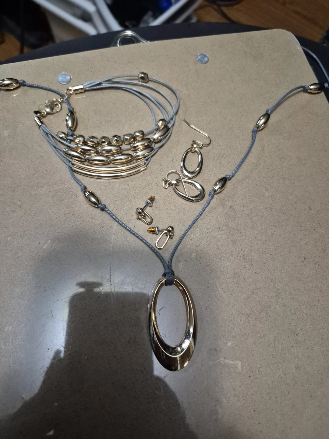 Gold Tone Necklace, Bracelet, and Earrings Set