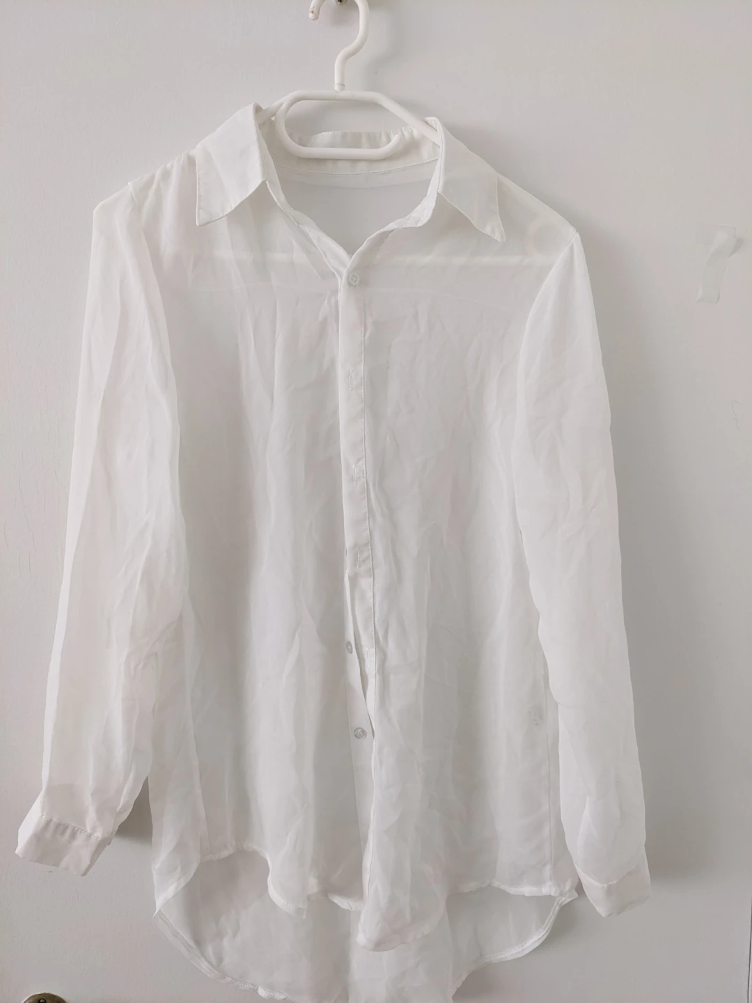 Transparent loose white button-up shirt