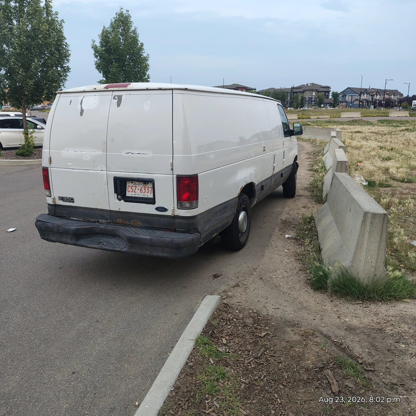 White Ford E-350 Super Duty Cargo Van