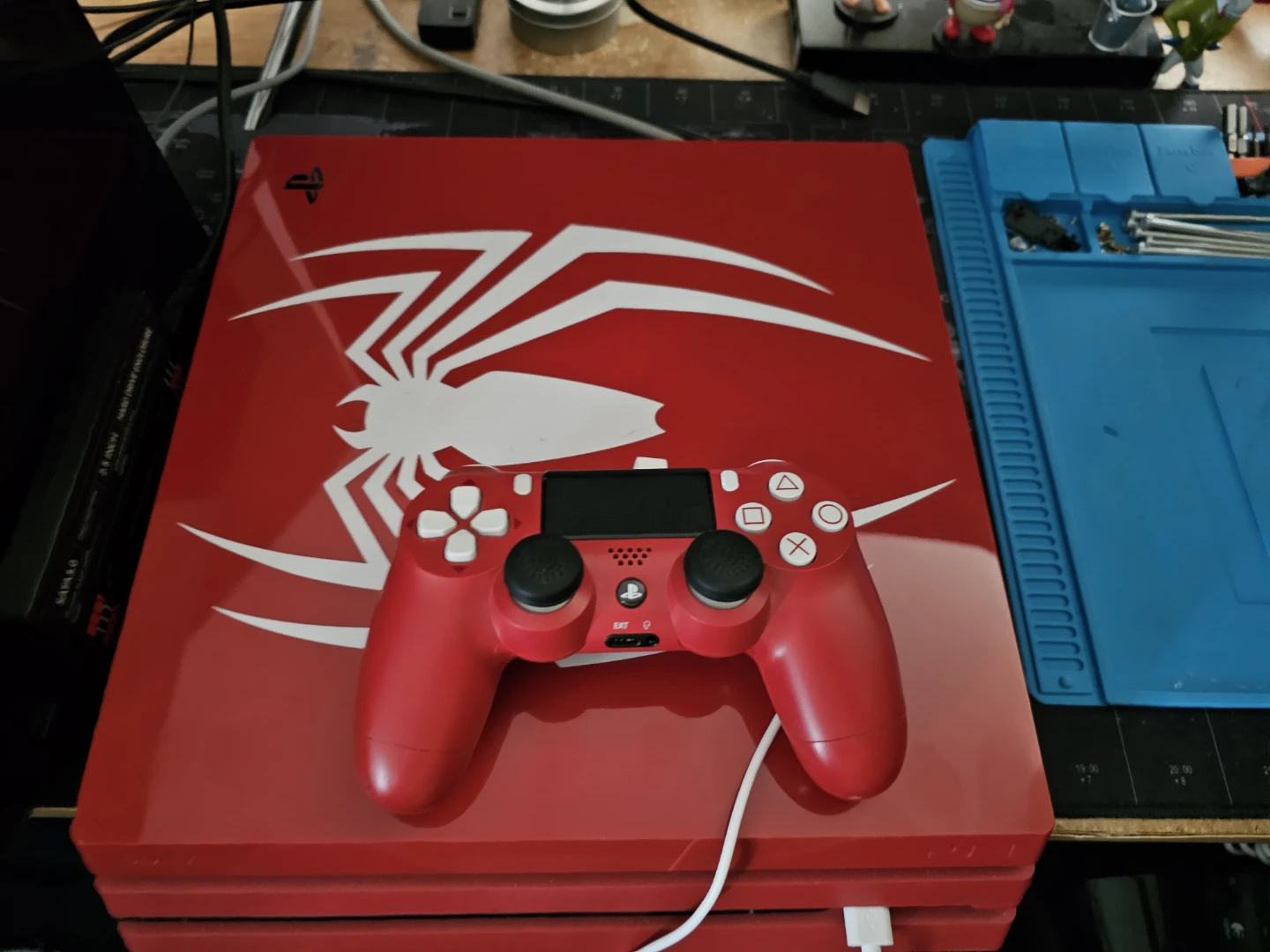 Ps4 Pro Spiderman Edition console with official controller