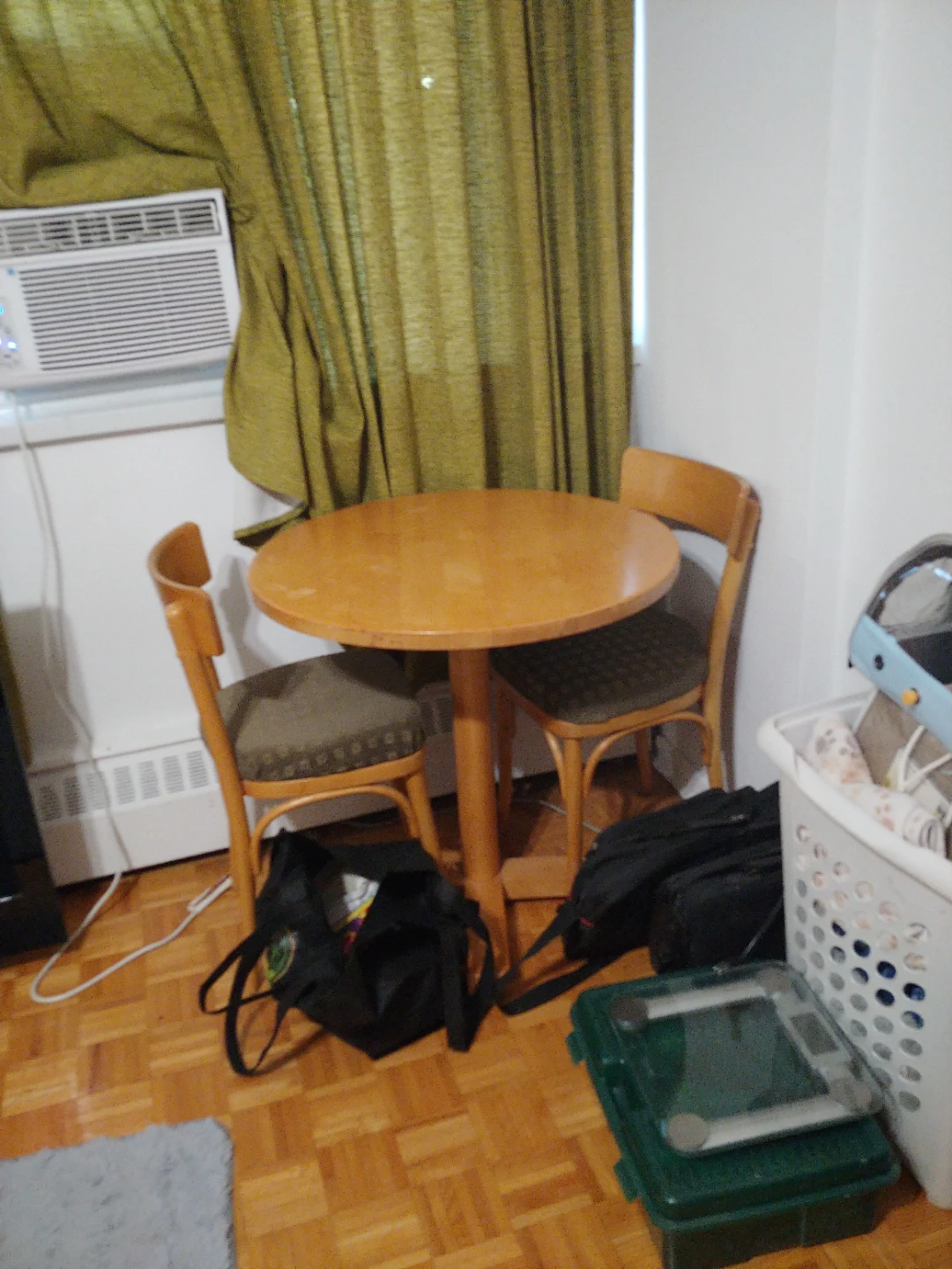 Wooden round bistro table and two chairs