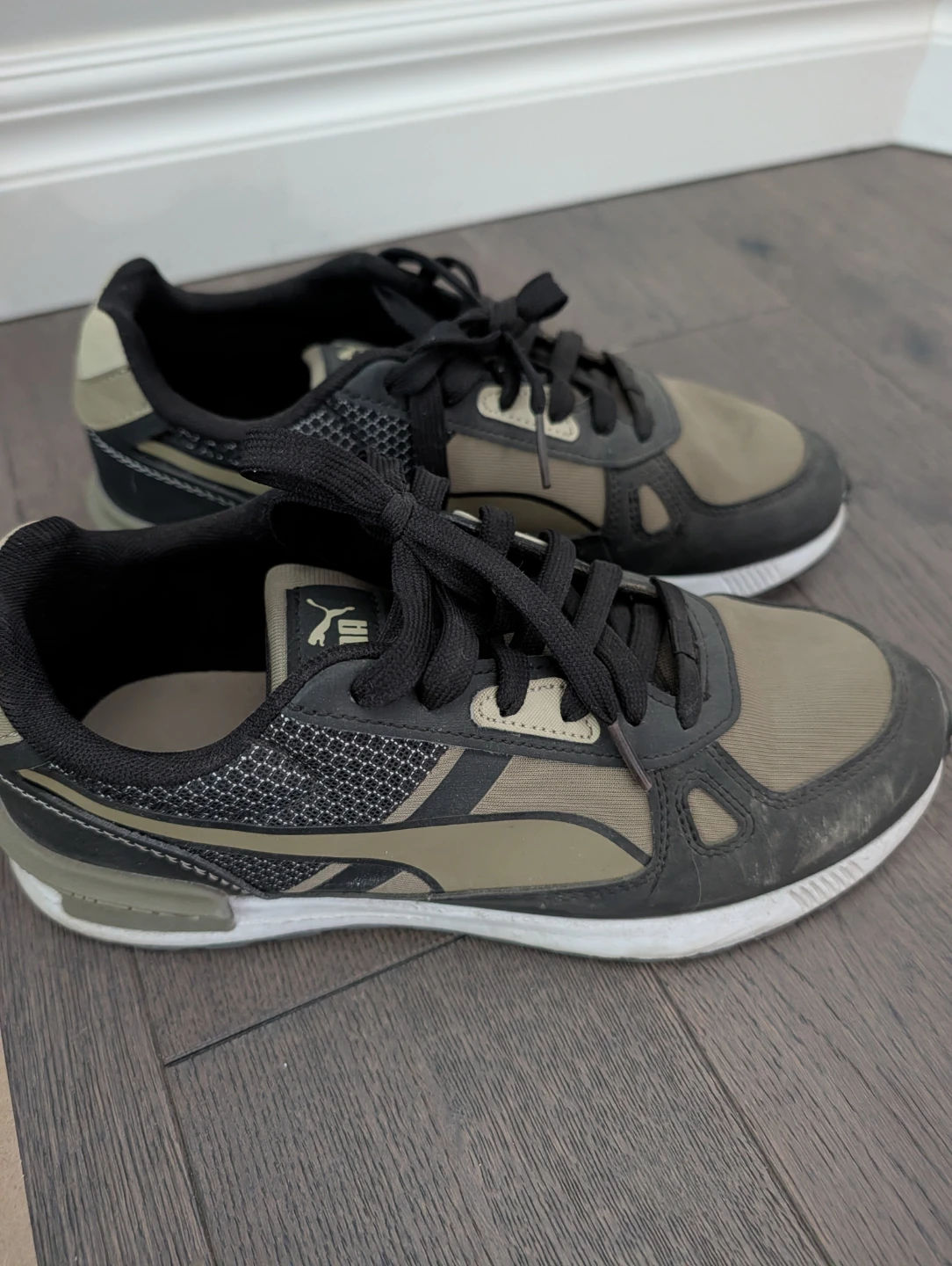 Puma olive and black sneakers