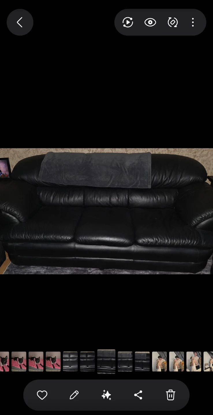 Black leather couch and love seat