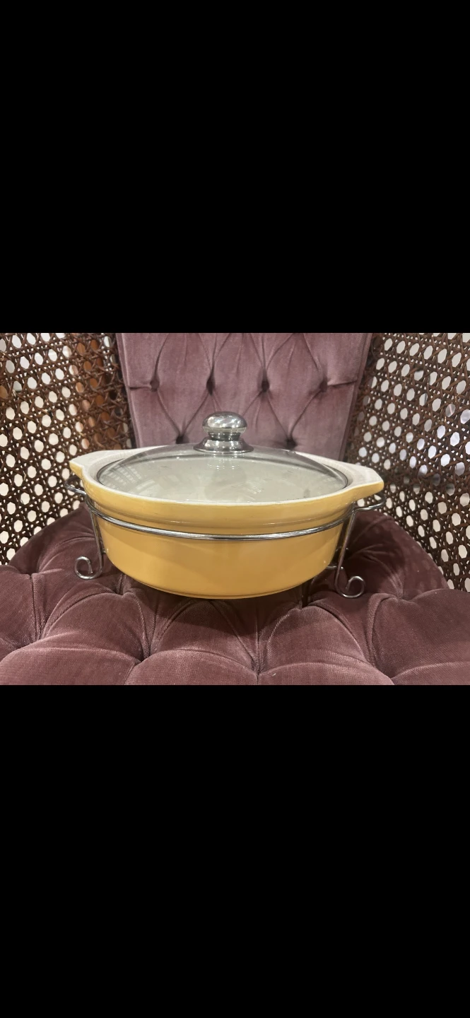 Yellow ceramic casserole dish with stand