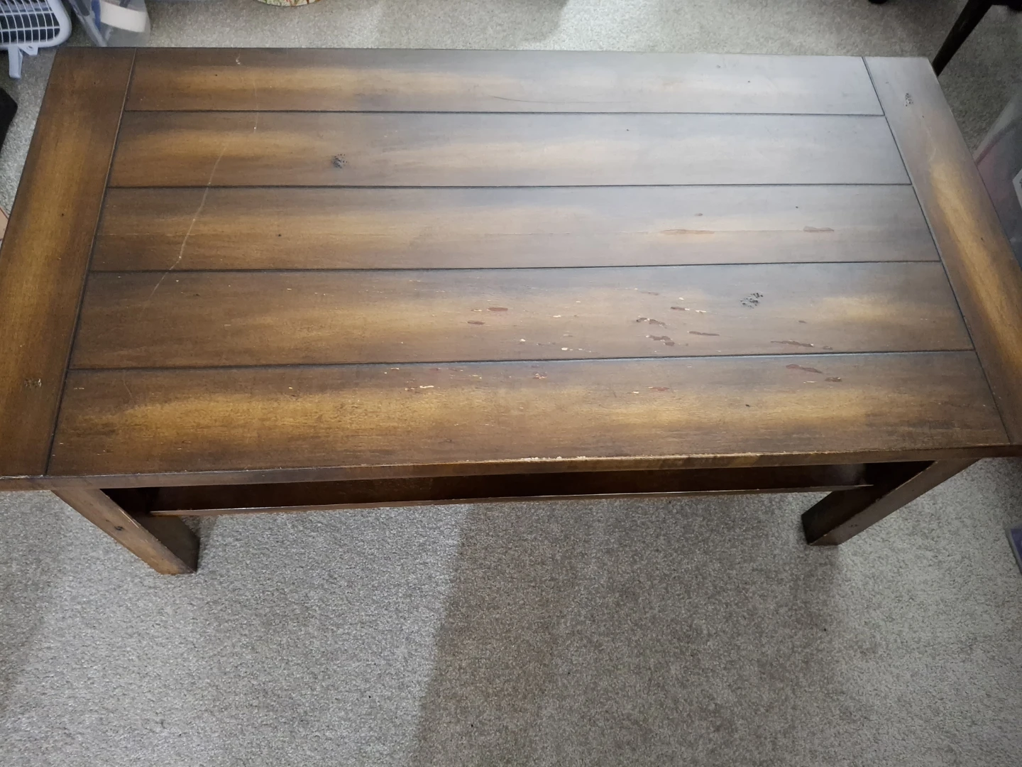 Dark wood plankstyle coffee table with lower shelf