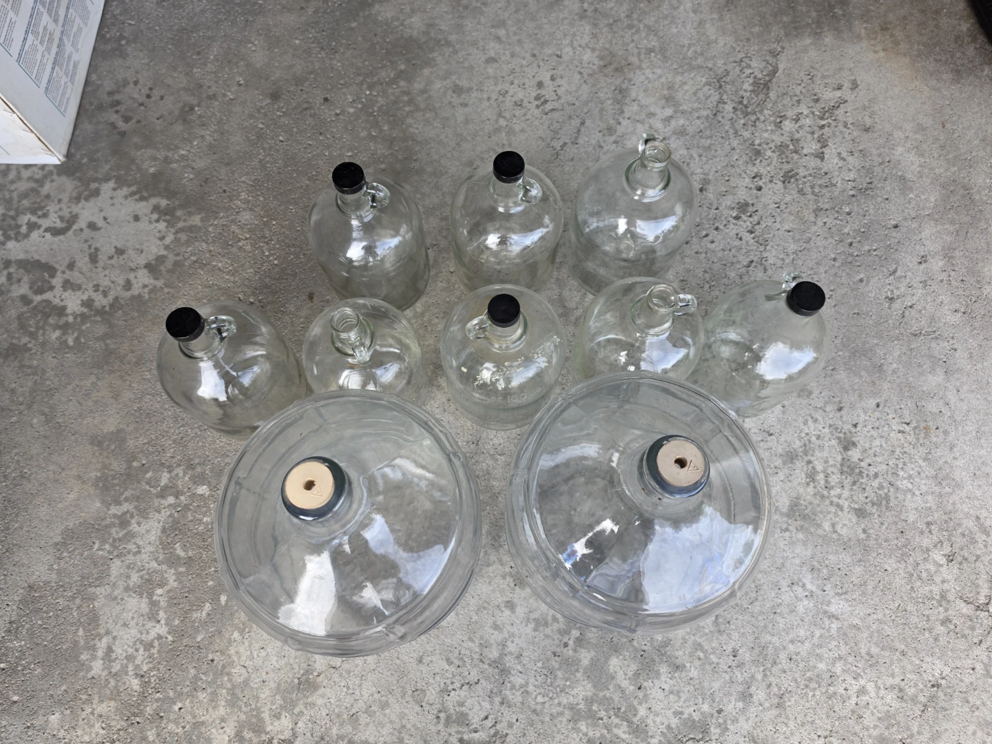 Assorted glass carboys and jugs
