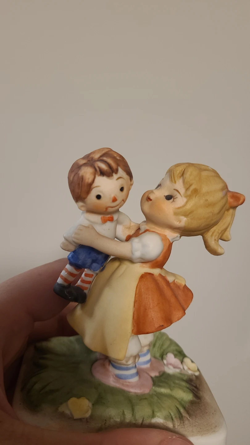 Ceramic Girl Figurine with Doll