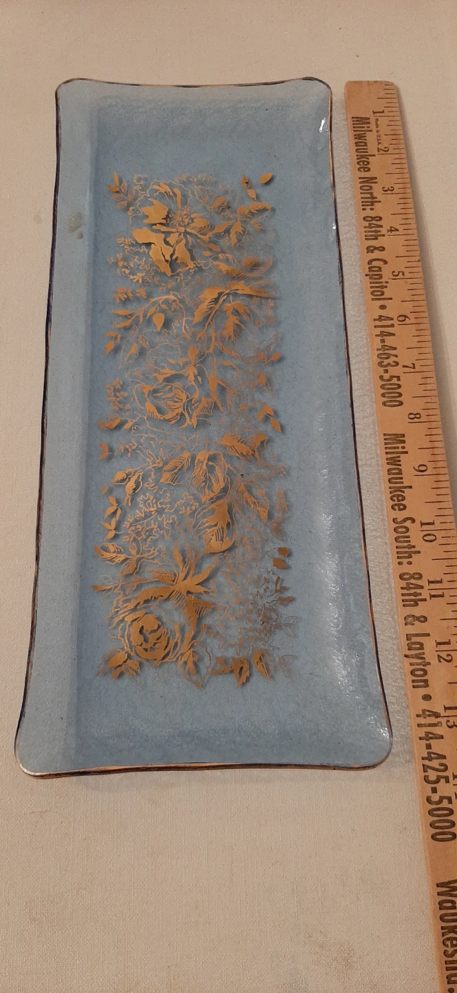 Blue Glass tray with a Gold floral design.