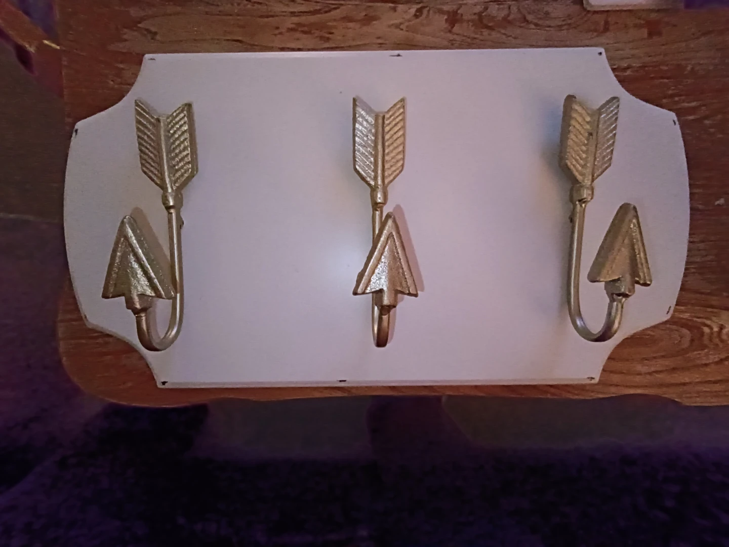 White Wall Hook Rack with Gold Arrow Design