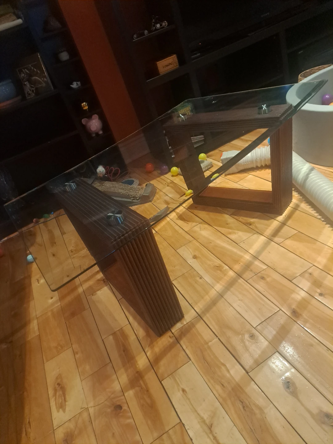 Glass top coffee table with ribbed wooden base