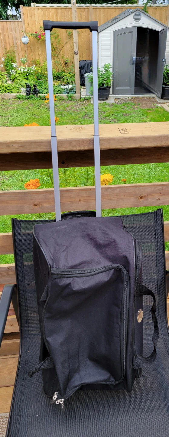 Rolling Soft Sided suitcase with extending handle