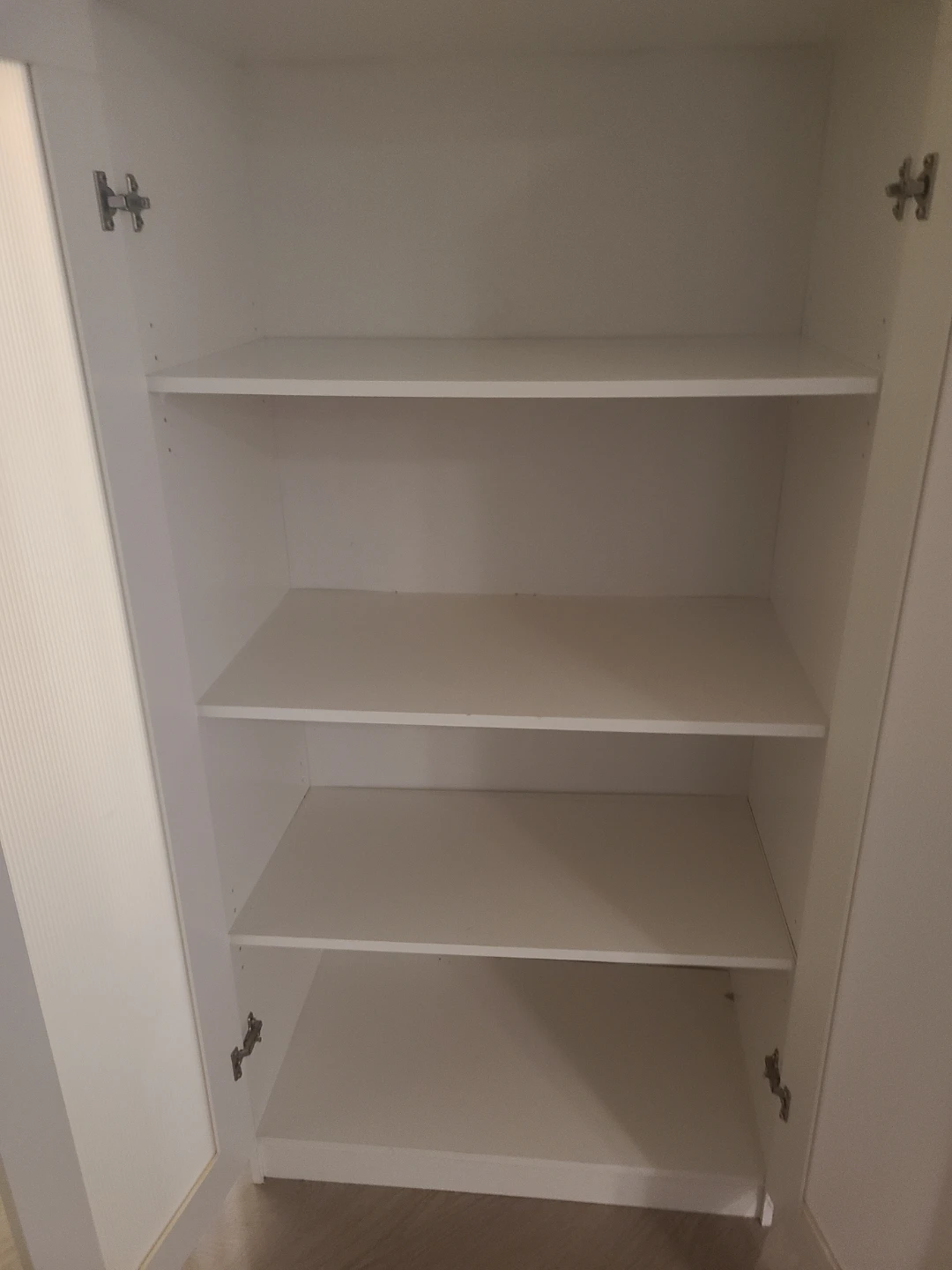White IKEA cabinet with frosted glass doors