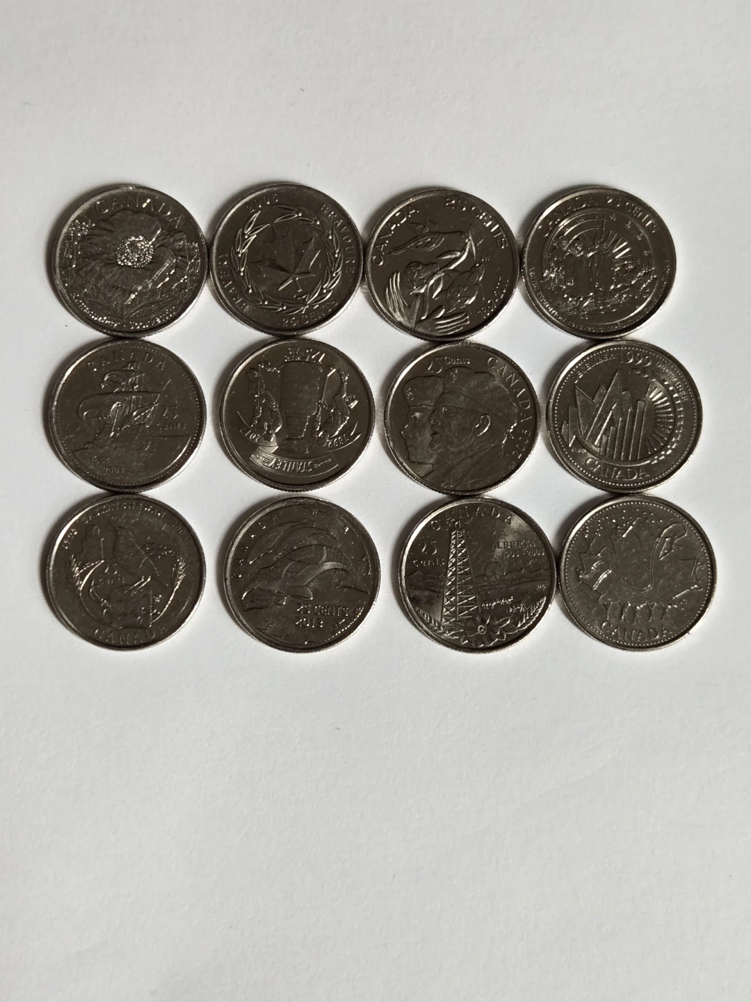 Collection of 12 Commemorative Canadian Quarters