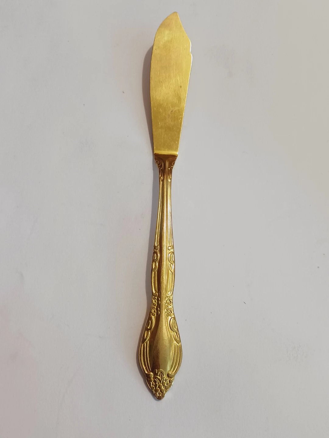 New. Gold-Tone Butter Spreader