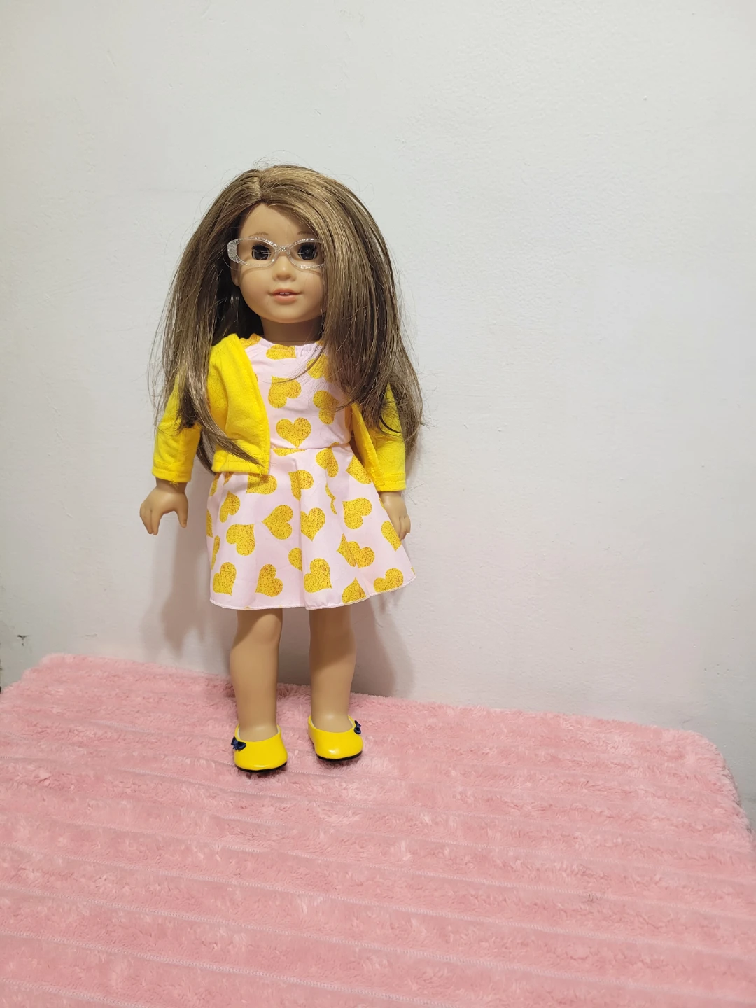 American Girl Doll with Yellow Cardigan and Heart Dress
