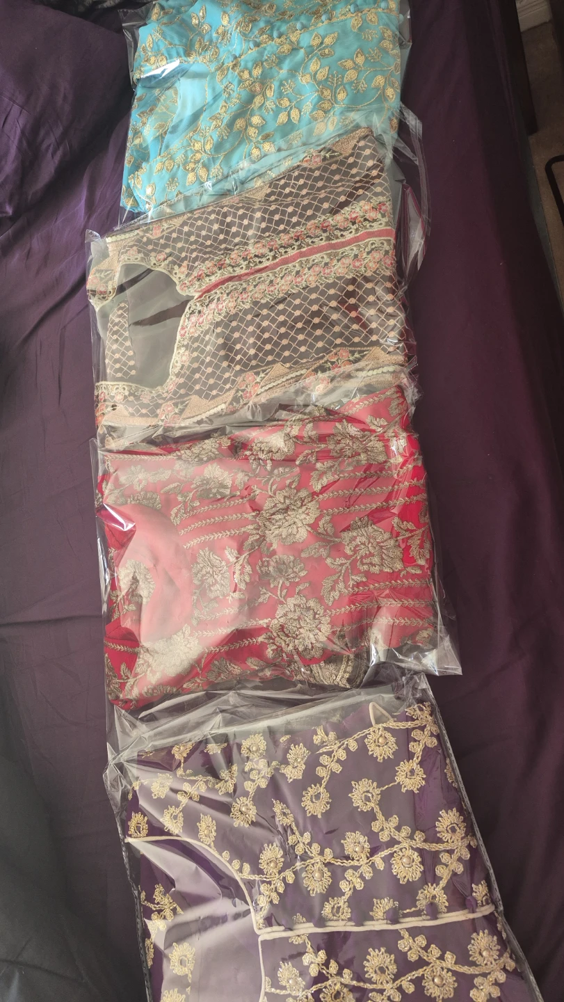 Four Embroidered Salwar Kameez Suits