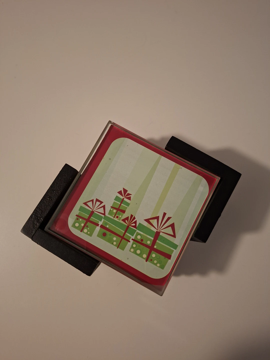 Four glass coasters with a Christmas theme