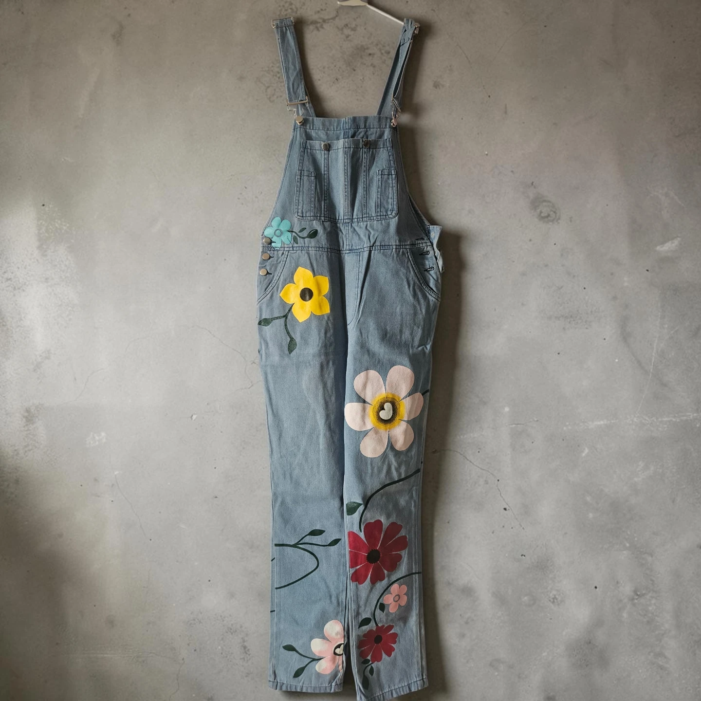 Light wash denim overalls with floral print