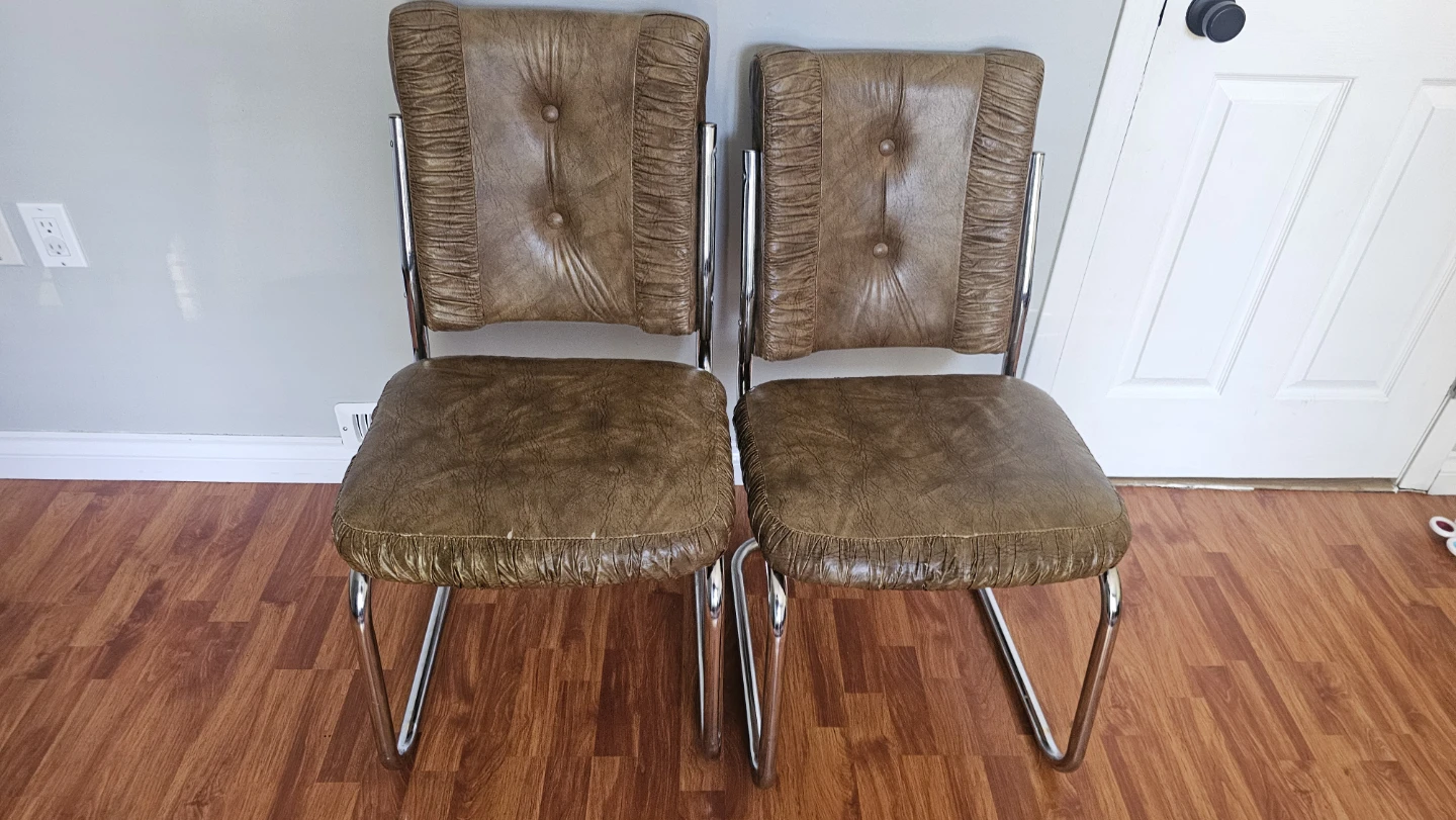 Pair of vintage brown vinyl chrome dining chairs