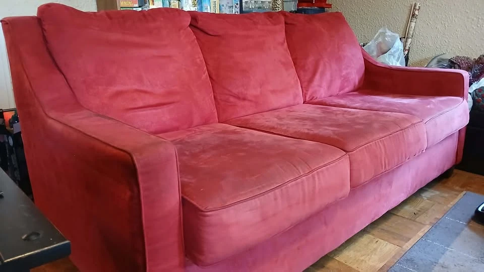 Red three-seater couch 🏈