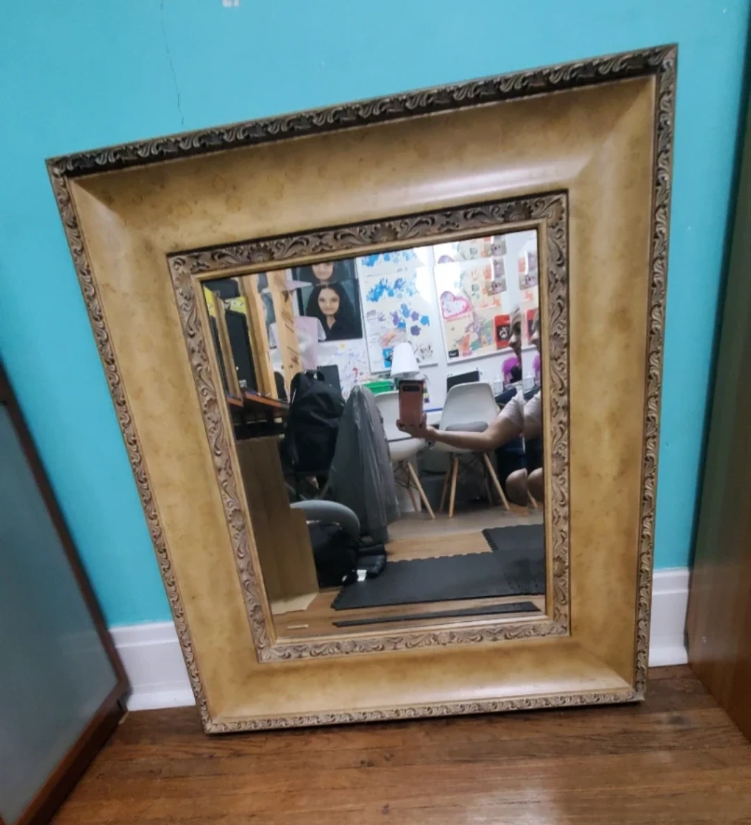 Large ornate wall mirror with gold frame