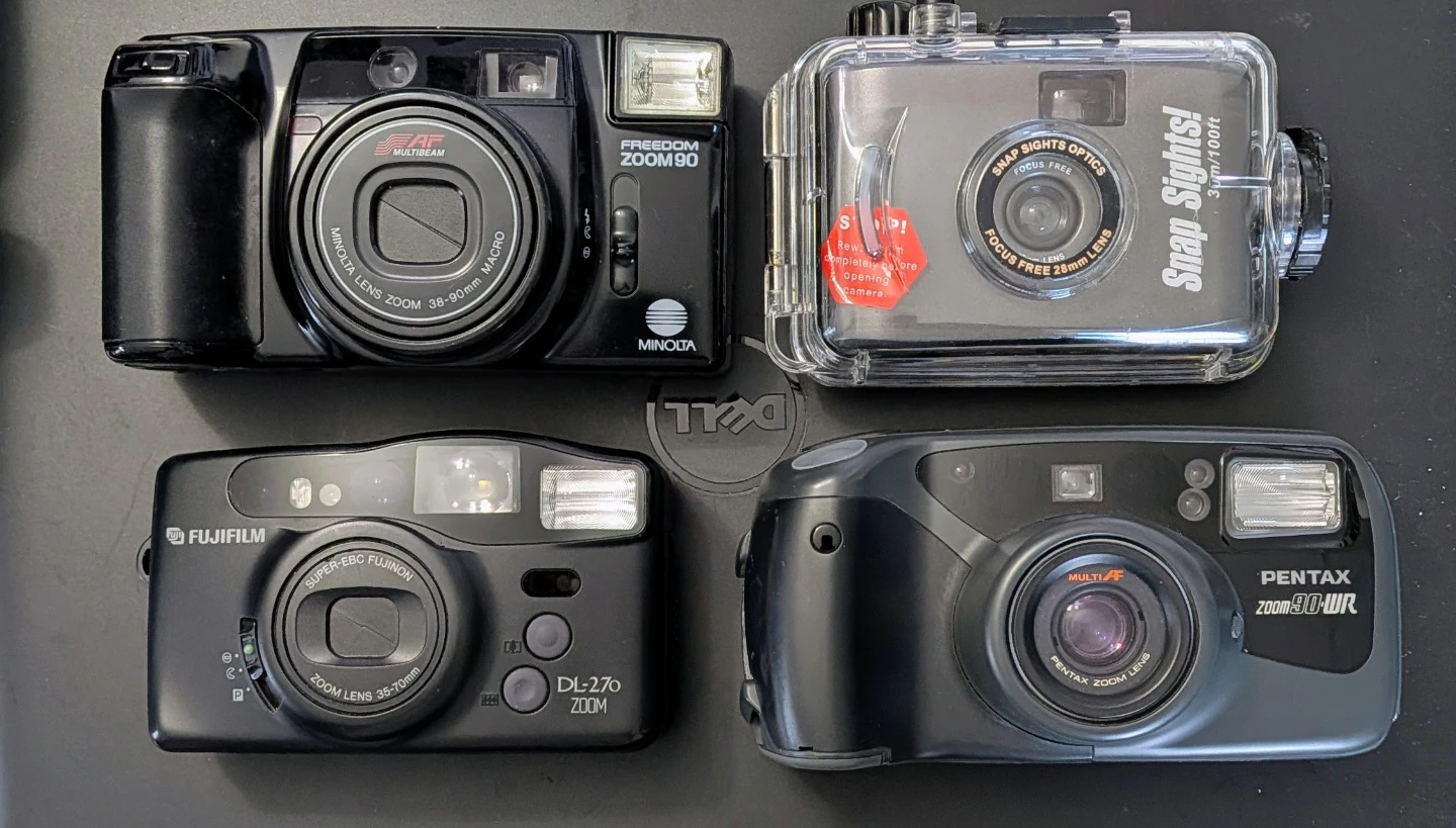 Collection of 7 Film Cameras and APS Film
