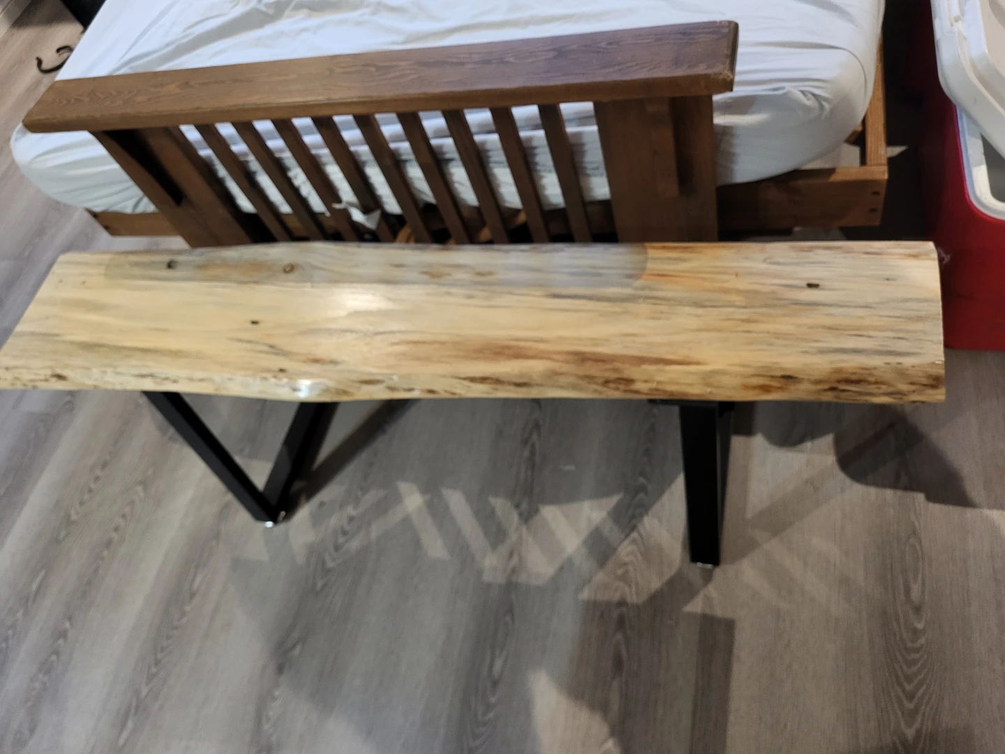 Live edge wooden bench with black metal legs