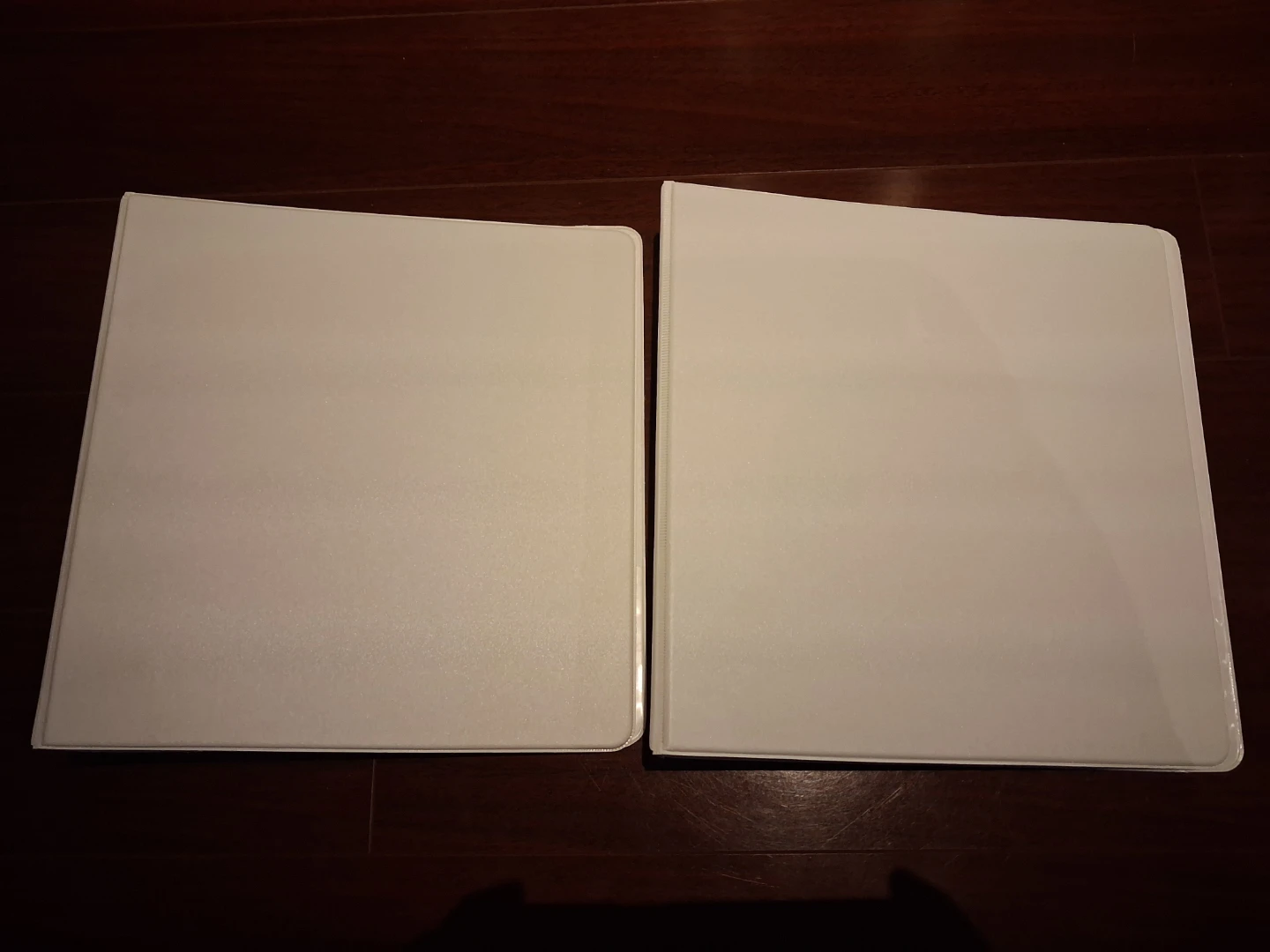 Two 1.5-inch White Vinyl Binders
