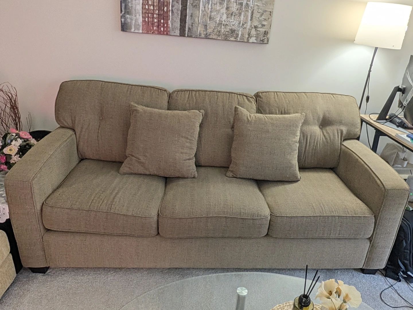 Three-seater beige fabric sofa
