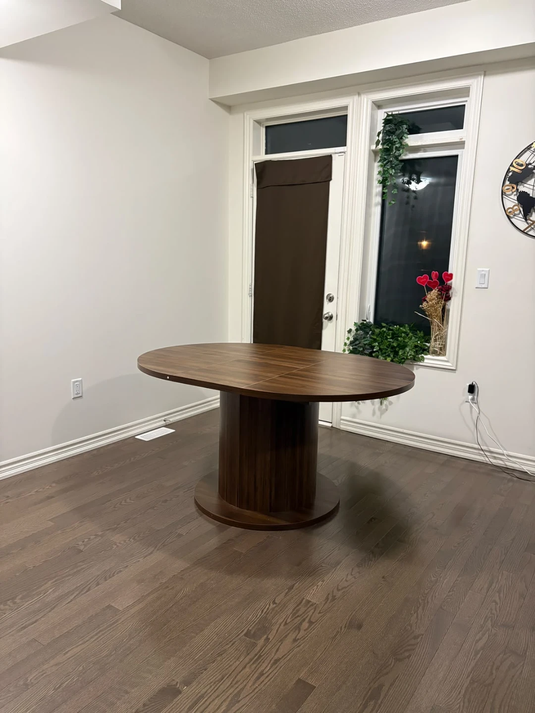 Walnut finish round dining table