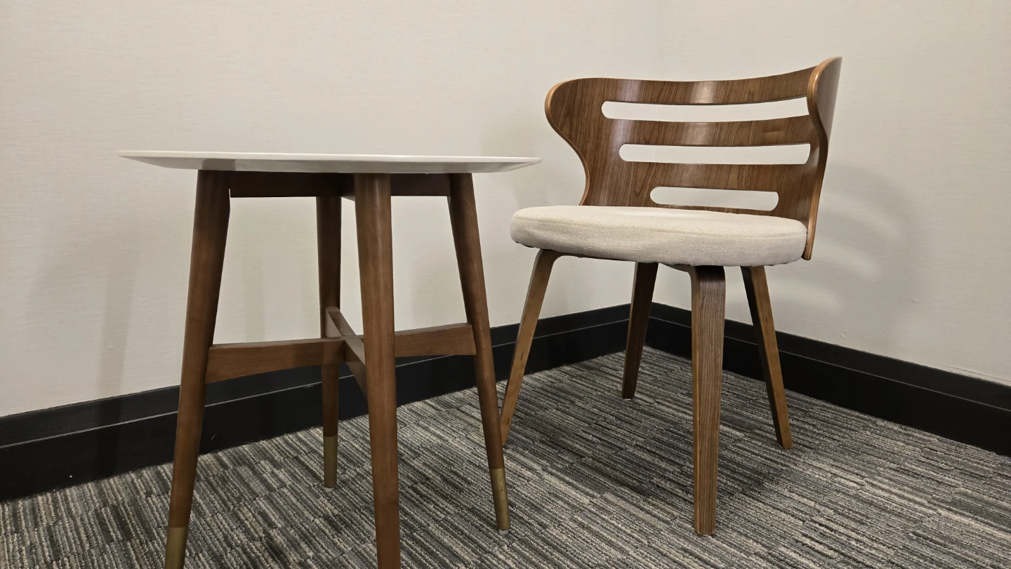 Mid-century modern round side table + sculptural wood chair