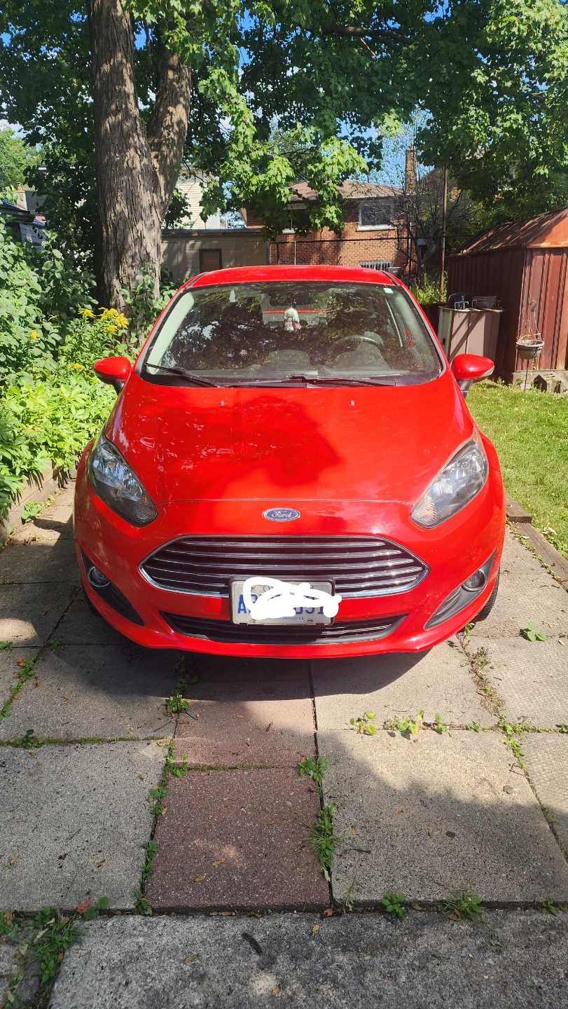 Red Ford Fiesta Sedan