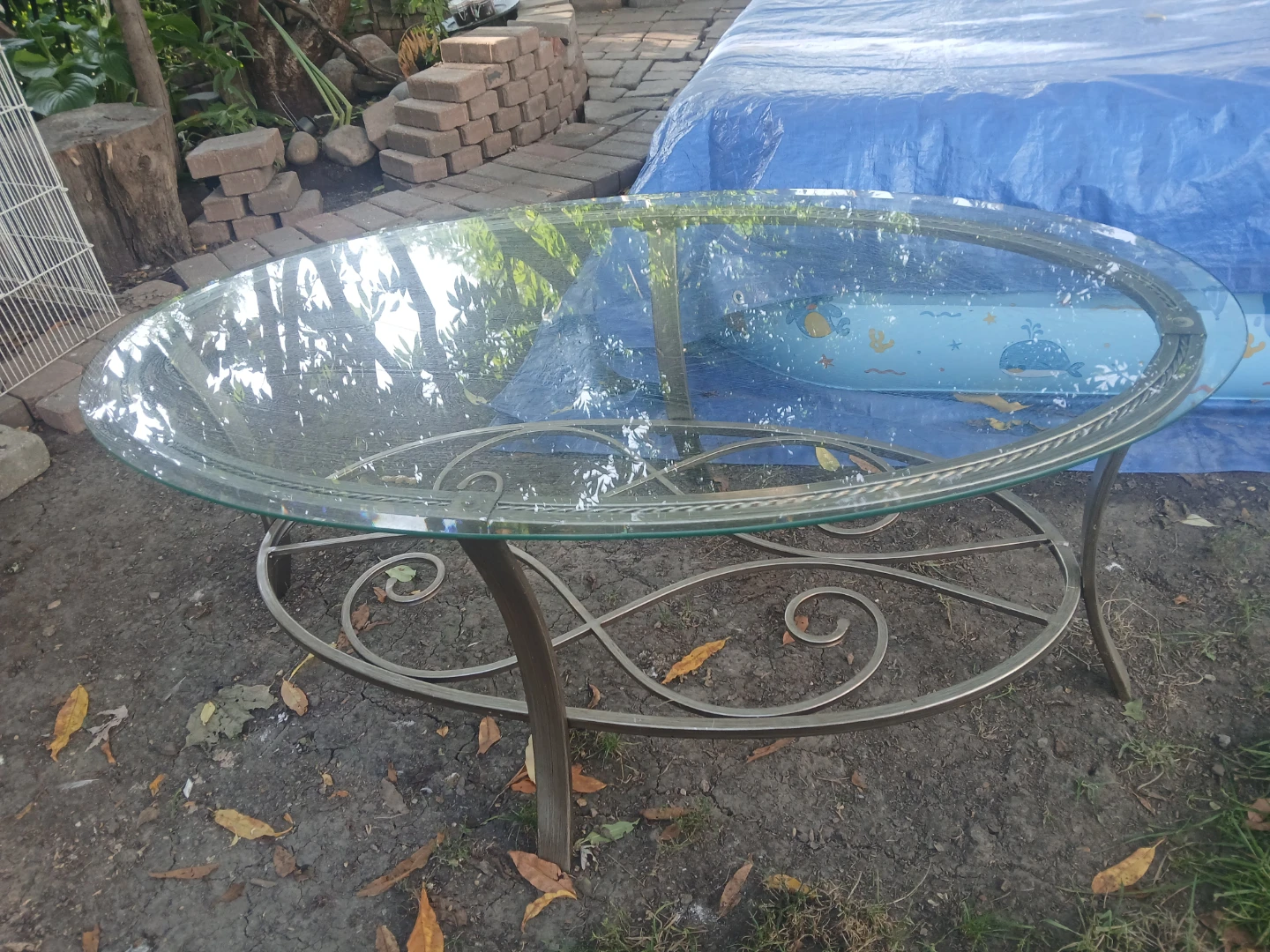 Oval Glass Coffee Table with Metal Scrollwork Base - photo 2