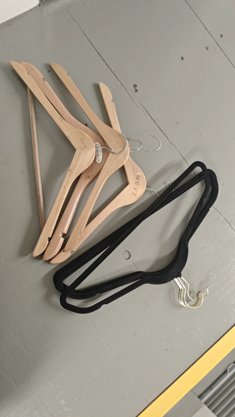 Assorted wood and velvet hangers